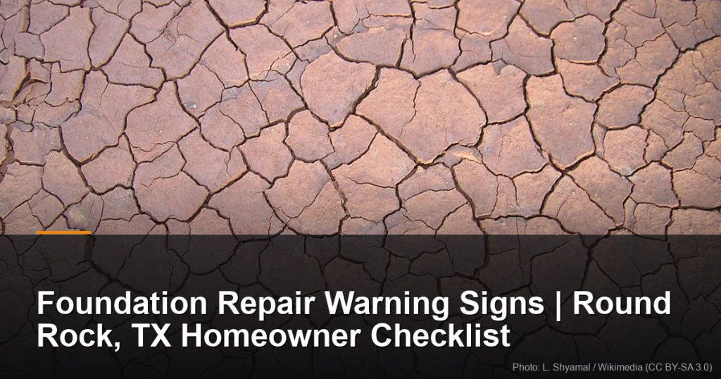 Cracked dry expansive clay soil in a polygonal pattern — Round Rock, TX foundation repair