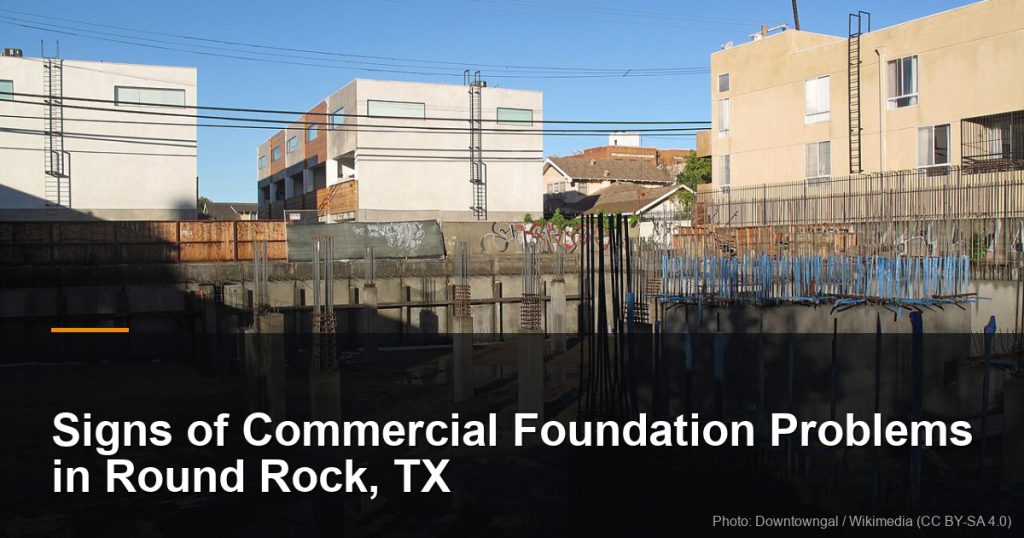 Large excavated building foundation with retaining walls and rebar — Round Rock, TX foundation repair